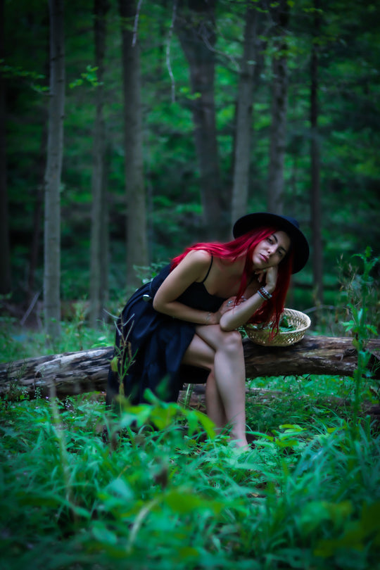 Jessica Rose Durante, Clinical Herbalist, gathering plants in the forest